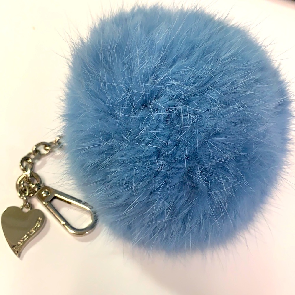 Lancaster Blue Fur Ball Purse Attachment Logo